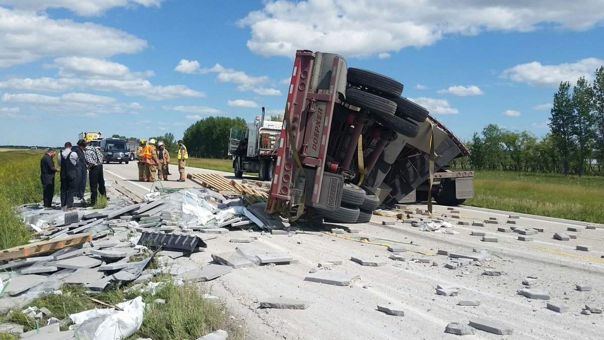 Bricks are all over a road south of Elie, Man.