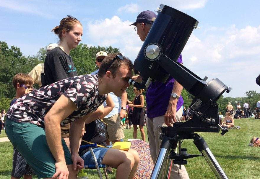 Calvin DeLima & Paige Habicht use a telescope to view the eclipse at Western University, on August 21, 2017.