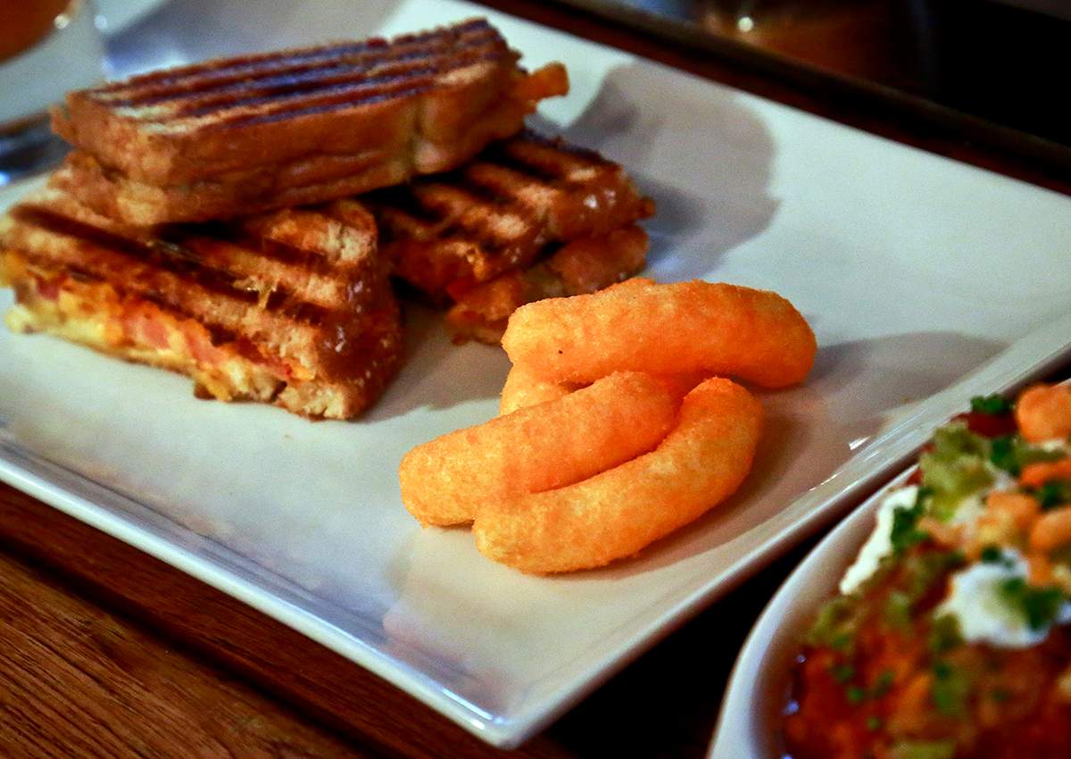 A grill cheese made with Cheetos is shown during a press preview for a three-day pop-up restaurant featuring an all-Cheetos menu, Tuesday Aug. 15, 2017, in New York.