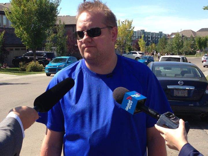 Cordell Brown speaks to reporters a day after Edmonton police announced charges have been laid in connection with the fire that killed his young son.