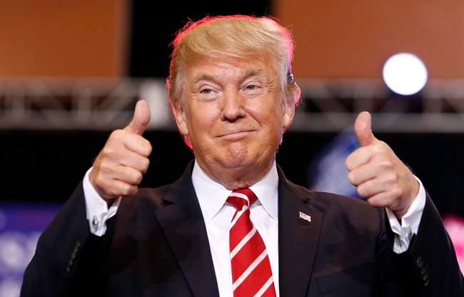 U.S. President Donald Trump reacts before speaking at a rally at the Phoenix Convention Center, in Phoenix, Ariz., on Tuesday, August 22, 2017.