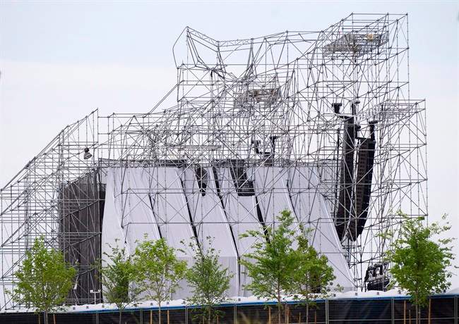 A collapsed stage is shown at a Radiohead concert at Downsview Park in Toronto on June 16, 2012. Lawyers for an entertainment company and an engineer accused in a deadly 2012 stage collapse at an outdoor Radiohead concert in Toronto are asking an Ontario court to stay the charges against them. The entertainment company Live Nation and an engineer, Domenic Cugliari, are arguing the case has seen unreasonable delays that violate their right to a timely trial. 