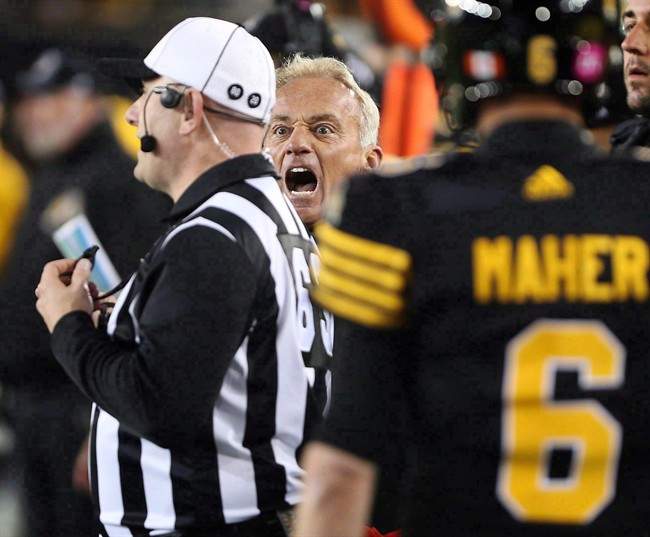Jeff Reinebold yells at a referee following an attempted on-side kick by the Hamilton Tiger-Cats against the Edmonton Eskimos on October 28, 2016. The winless Ticats shook up their coaching staff on Tuesday by replacing defensive co-ordinator Reinebold.
