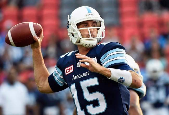 Toronto Argonauts quarterback Ricky Ray (15) passes against the Calgary Stampeders during first half CFL football action in Toronto on Thursday, August 3, 2017.