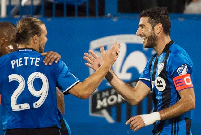 Montreal Impact's Ignacio Piatti, right, celebrates with teammate Samuel Piette.