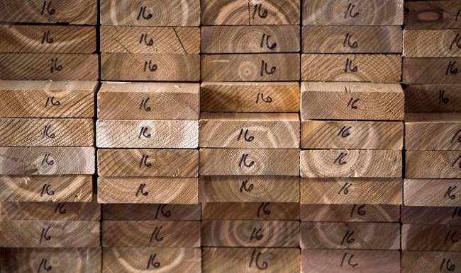 Cedar planks are stacked at a lumber yard, Tuesday, April 25, 2017 in Montreal.