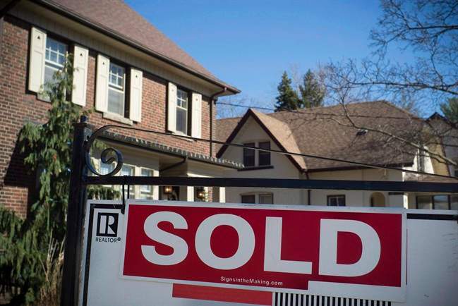 A sold sign is shown in front of west-end Toronto homes Sunday, April 9, 2017.