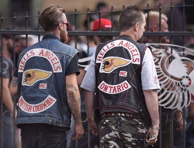 Members of the Hells Angels from British Columbia and Ontario enter the Hells Angels Nomads compound during the group's Canada Run event in Carlsbad Springs, Ont., near Ottawa, on Saturday, July 23, 2016.