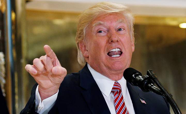 U.S. President Donald Trump answers questions about his response to the violence, injuries and deaths at the "Unite the Right" rally in Charlottesville as he talks to the media in the lobby of Trump Tower in Manhattan, New York, August 15, 2017.   