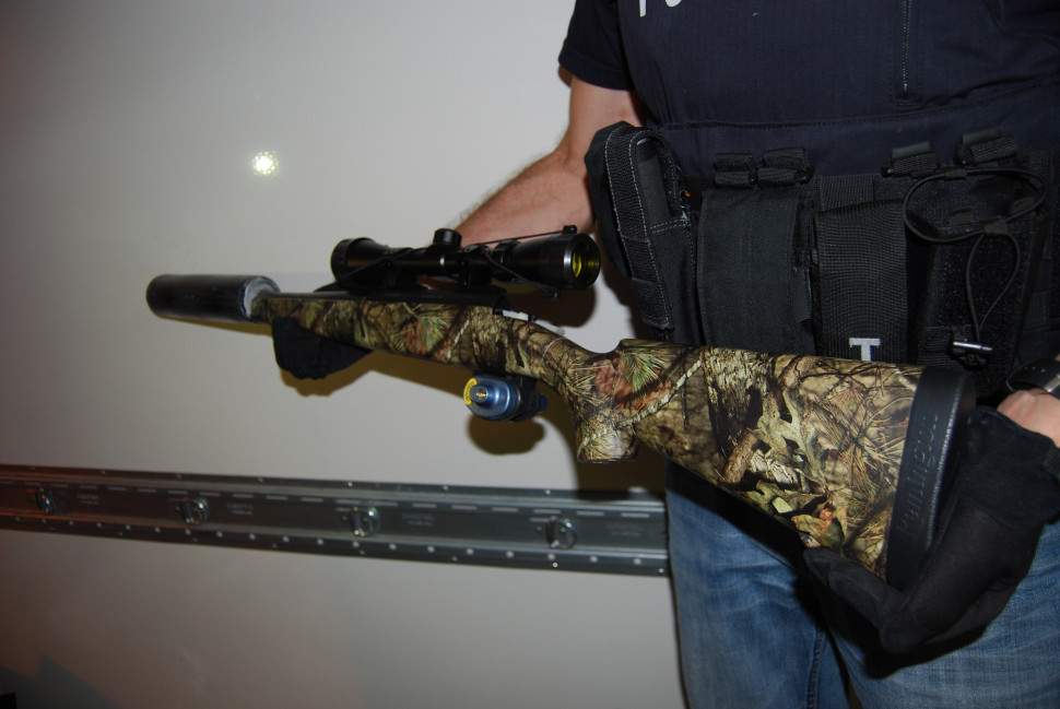 A silenced rifle was seized during the investigation by New Brunswick RCMP