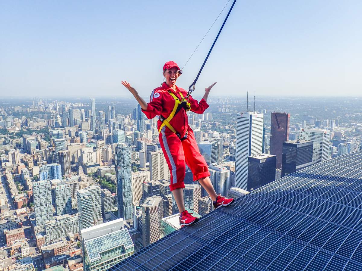 Just chillin’! Global’s Kim Sullivan walks on the edge of the CN Tower in Toronto, Monday, July 31, 2017.