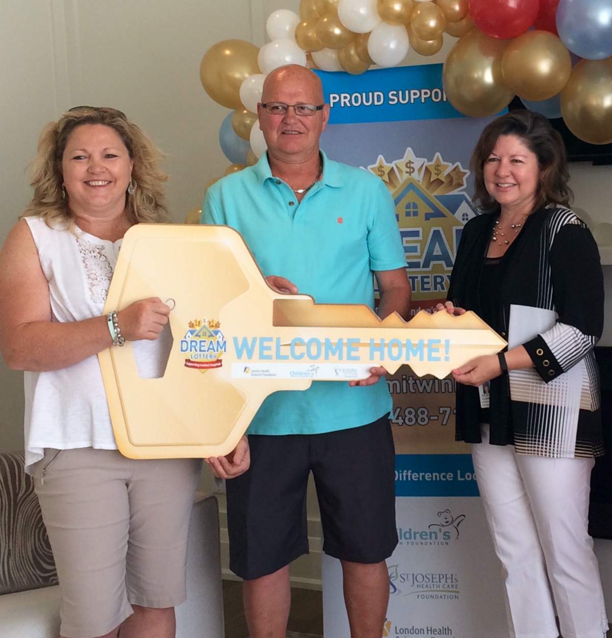 From left to right: Denise Neal and Dermot Brennan, the winners of the spring edition of the Dream Lottery, and Michelle Campbell, the President and CEO of St. Joseph’s Health Care Foundation.