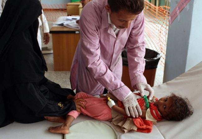 A Yemeni child suspected of being infected with cholera is checked by a doctor at a makeshift hospital operated by Doctors Without Borders (MSF) in the northern district of Abs in Yemen’s Hajjah province, July 16, 2017.