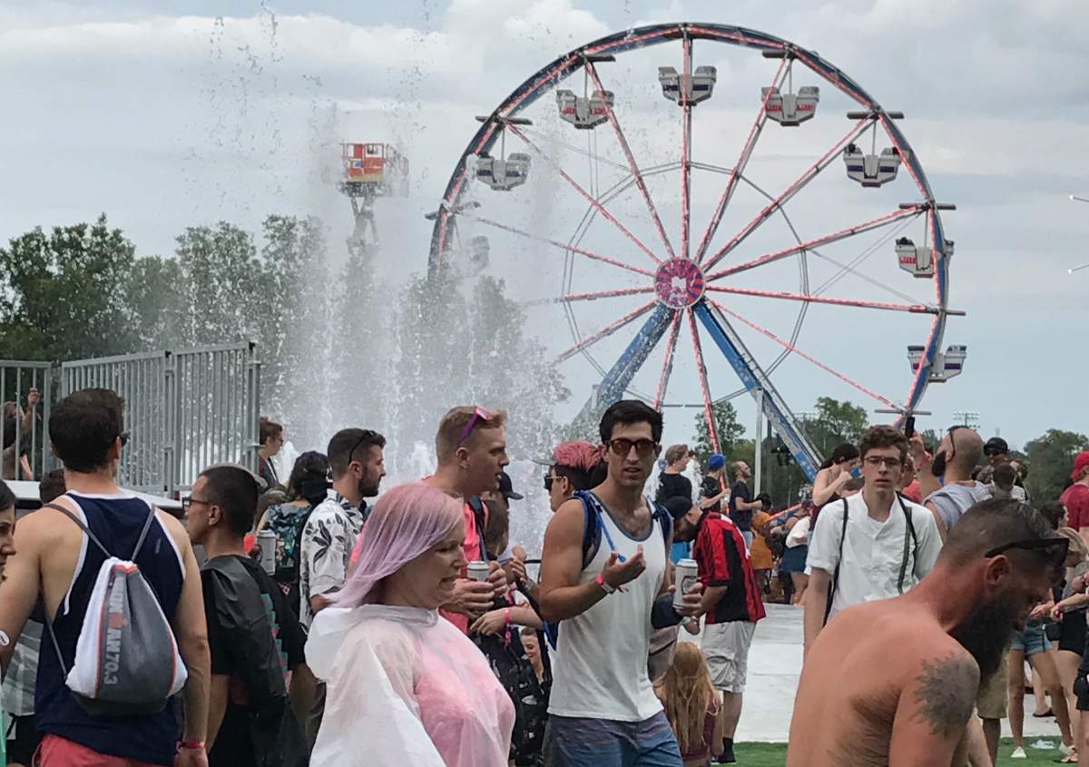 A fountain and a ferris wheel are a few of the attractions at the 2017 Osheaga music and art festival.