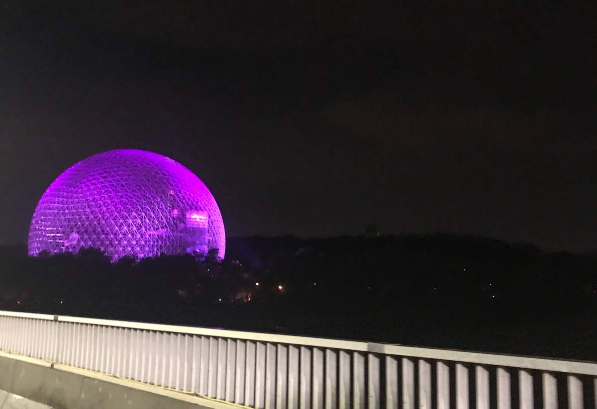 The Montreal Biosphere shines purple near the 2017 Osheaga music and art festival.