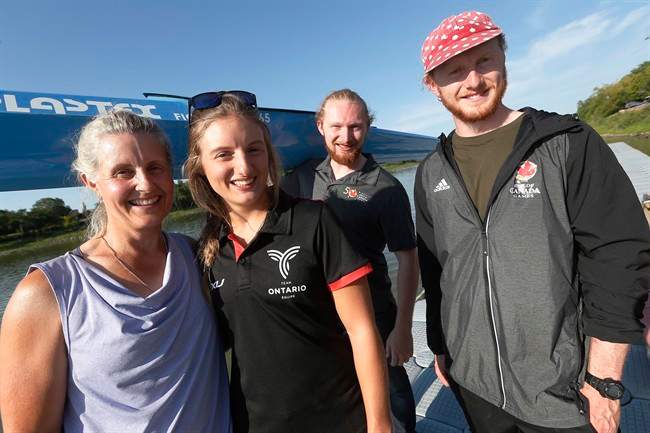 Members of the Vincent family, from left, Fiona, Lexy, Kenzie and Fearghus (father Mike is missing) carry their boats beside the Red River at the Manitoba Canoe and Kayak Centre, home of the Canada Games races, Sunday, August 6, 2017. Kayaking runs deep in the Vincent family at this summer's Canada Games and beyond.