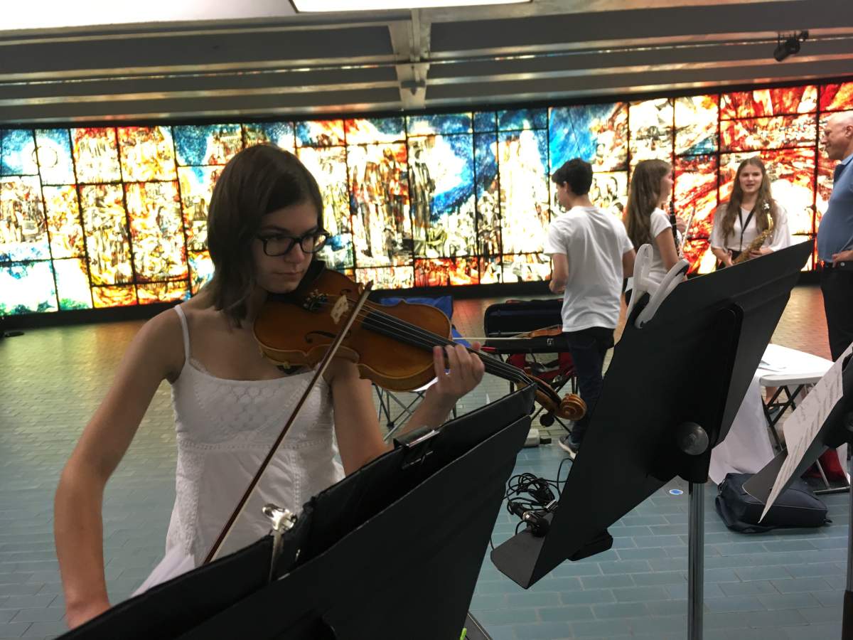 Lindsay Place High School students and graduates perform at the Place des Arts metro on Wednesday, August 16, 2017.
