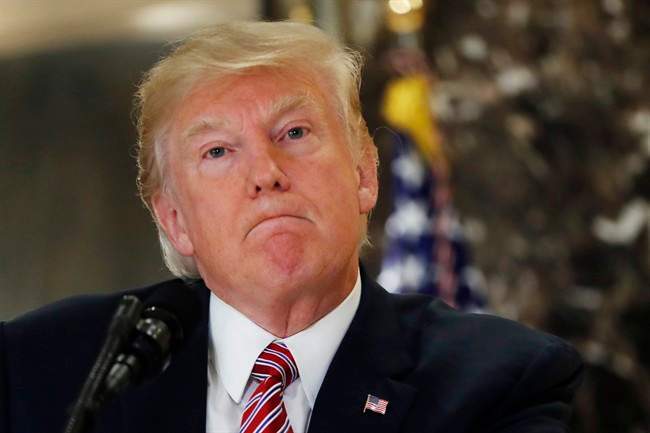 President Donald Trump listens to a question while meeting the media in the lobby of Trump Tower in New York, Tuesday, Aug. 15, 2017.