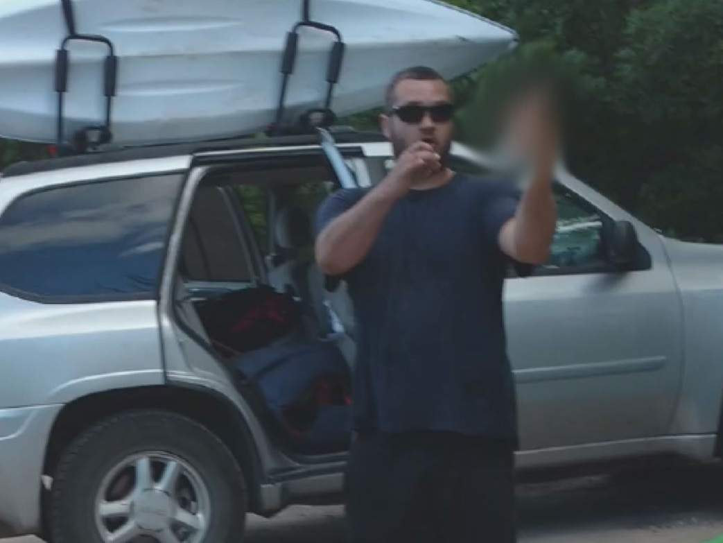 A still taken from a video posted by Kaniz Fatima shows a man giving the finger to the camera in July.
