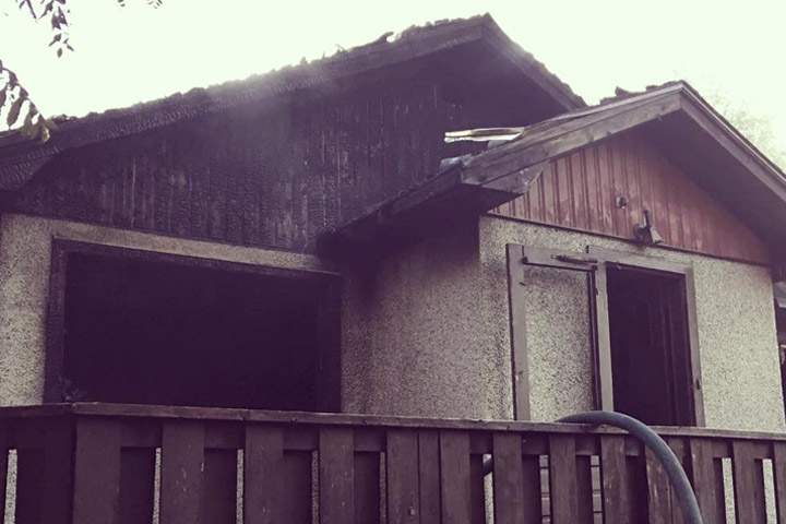 A man who was stabbed was pulled from a burning Prince Albert house by a passerby.