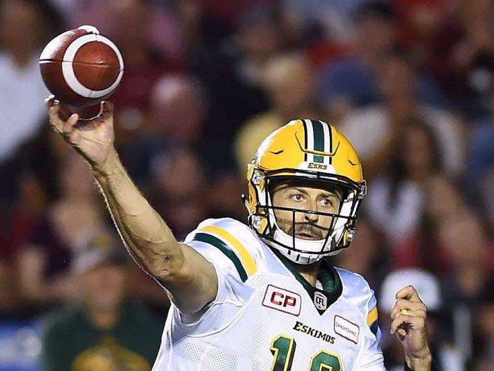 Edmonton Eskimos quarterback Mike Reilly (13) passes against the Ottawa Redblacks during first half CFL football action in Ottawa, Thursday, Aug.10, 2017. 