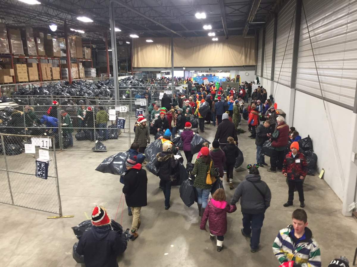 Volunteers deliver toys for 630 CHED Santas Anonymous Saturday, Dec. 17, 2016.