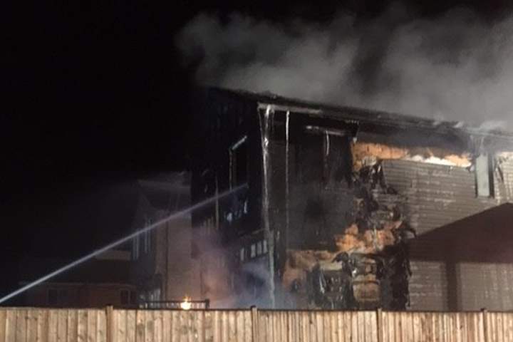 A home in Hampton Village has been destroyed by fire caused the careless disposal of cigarettes.