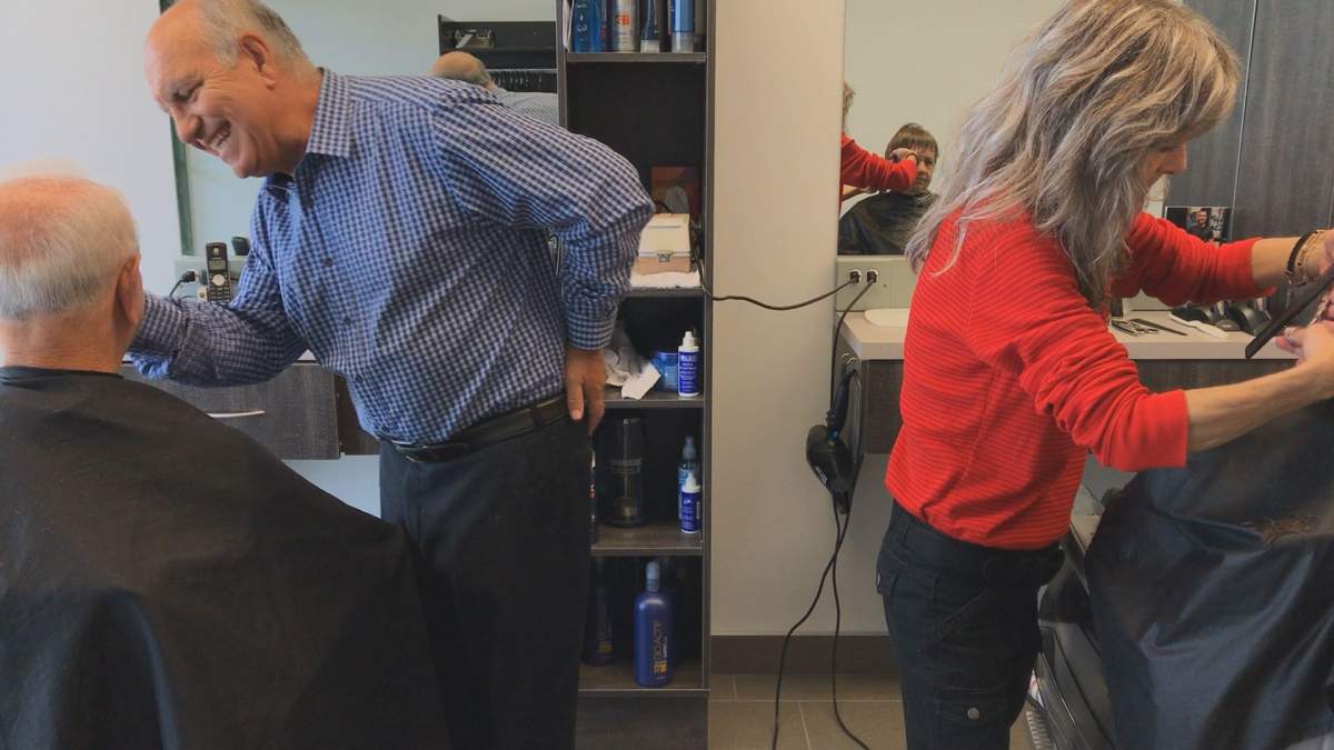 Mario Scione and Lyne Leblanc cutting hair on Thursday, August 17, 2017.