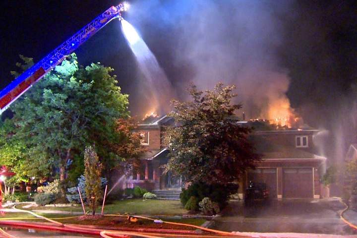 Firefighters battle a two-alarm blaze at a residence in Vaughan on Aug. 30, 2017.
