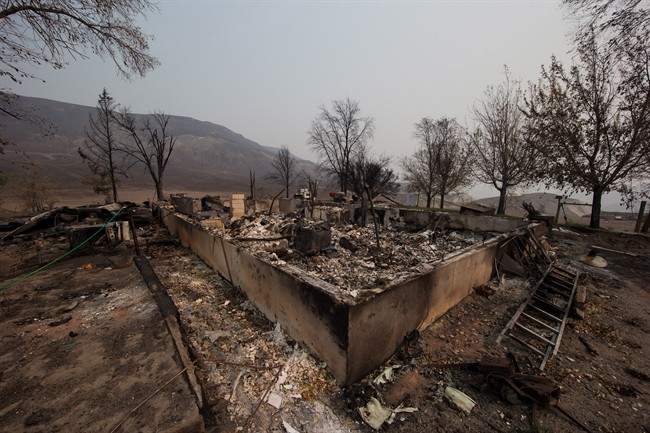A home destroyed by wildfire is seen on the Ashcroft First Nation near Ashcroft, B.C., on Tuesday August 1, 2017. 