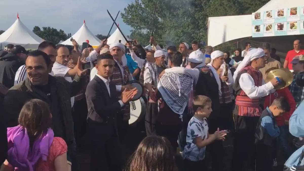 The couple was surrounded by family and friends along with festivalgoers Saturday.