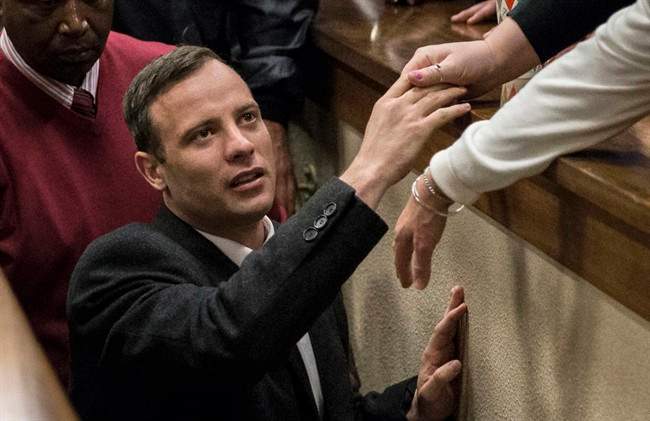 FILE - In this July 6, 2016, file photo, Oscar Pistorius leaves the High Court in Pretoria, South Africa, after a judge passed a new sentence of six years imprisonment after his conviction was changed to murder for shooting girlfriend Reeva Steenkamp in 2013. 