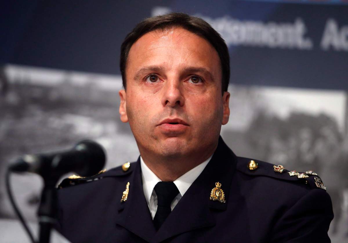 Royal Canadian Mounted Police assistant commissioner James Malizia speaks at a press conference at RCMP headquarters in Ottawa about the arrest of a Somali man, Ali Omar Ader, for his involvement in the kidnapping of Canadian journalist Amanda Lindhout, Friday, June 12, 2015. THE CANADIAN PRESS/ Patrick Doyle