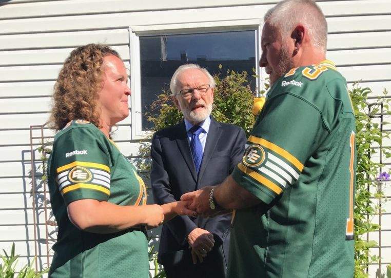 Kelly and Wes Goddard marry in Eskimos garb ahead of the Labour Day Classic on Sept. 4, 2017.