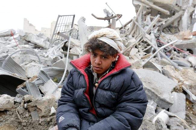 A Yemeni sits on debris of his relatives building allegedly hit by a Saudi-led airstrike in Sanaa, Yemen, 25 August 2017.