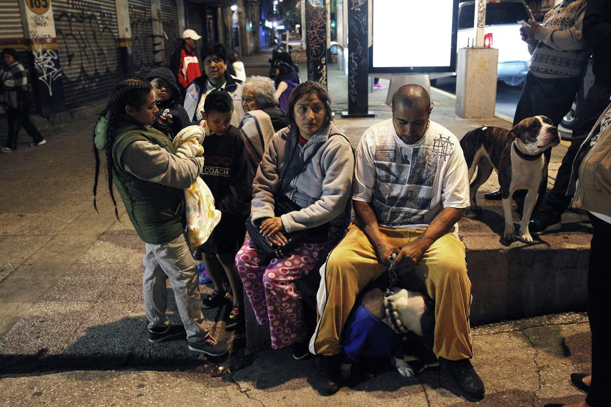 A family waits in the open in Coatzacoalcos, in the Veracruz state, Mexico, after a 8.2 magnitude earthquake violently shook Mexico, early 08 September 2017. EPA/ANGEL HERNANDEZ