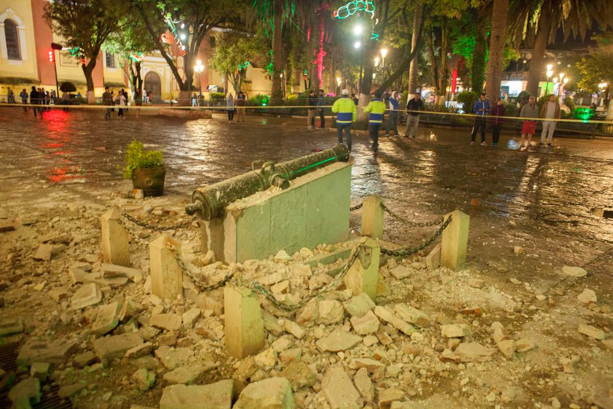 A monument surrounded by debris is cordoned off in the aftermath of an 8.1-magnitude earthquake in San Cristobal de Las Casas, state of Chiapas, Mexico, early Friday, Sept. 8, 2017.