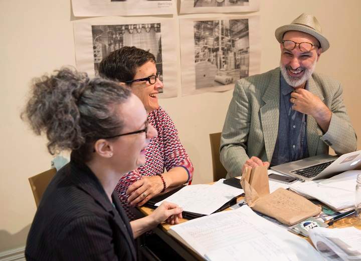 Musician and writer Dave Bidini, right, smiles as he attends a staff meeting in Toronto on Wednesday, Sept.13, 2017. Bidini is launching a monthly newspaper, the non-profit West End Phoenix, that is focussed on a downtown Toronto area. 