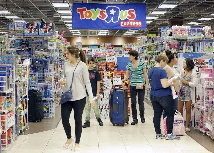 Consumers shop at a Toys “R” Us store in Miami.