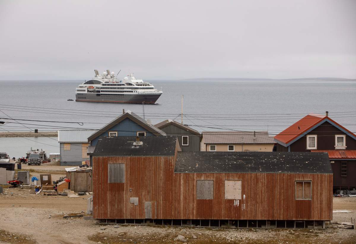 A cruise ship sits off the shore of the town of Gjoa Haven Nunavut on Saturday September 3, 2017.