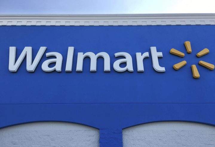 This Thursday, Jan. 5, 2017, photo shows corporate signage at a Walmart in Kissimmee, Fla. 