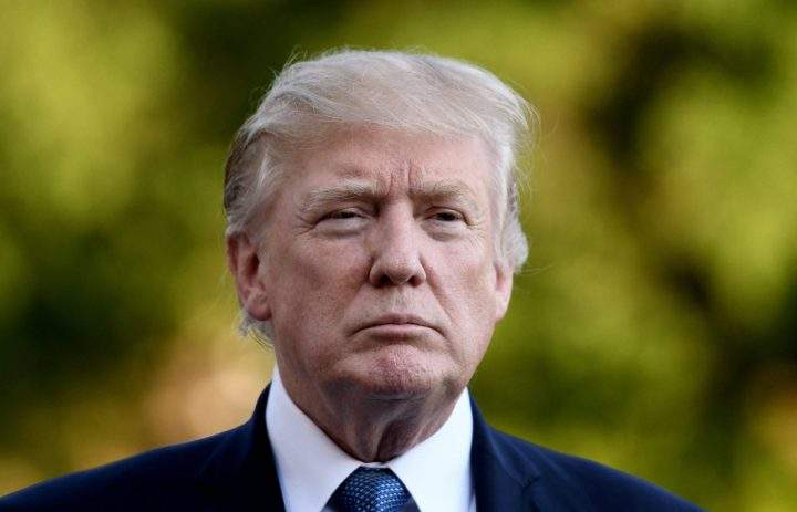 U.S. President Donald J. Trump answers questions from the press in Washington.