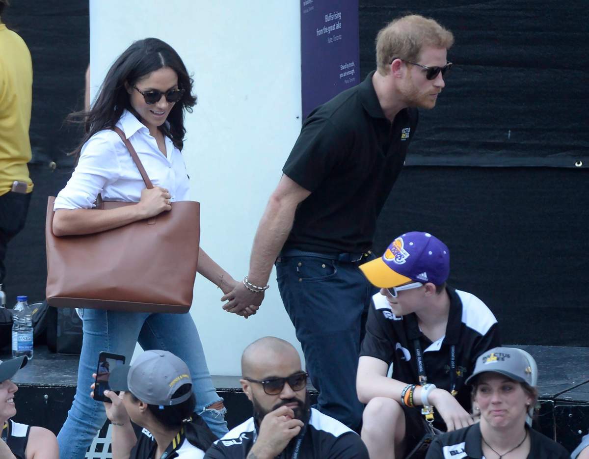 Prince Harry and his girlfriend Meghan Markle arrive at a wheelchair tennis event at the Invictus Games in Toronto, on Monday, Sept.25. THE CANADIAN PRESS/Nathan Denette