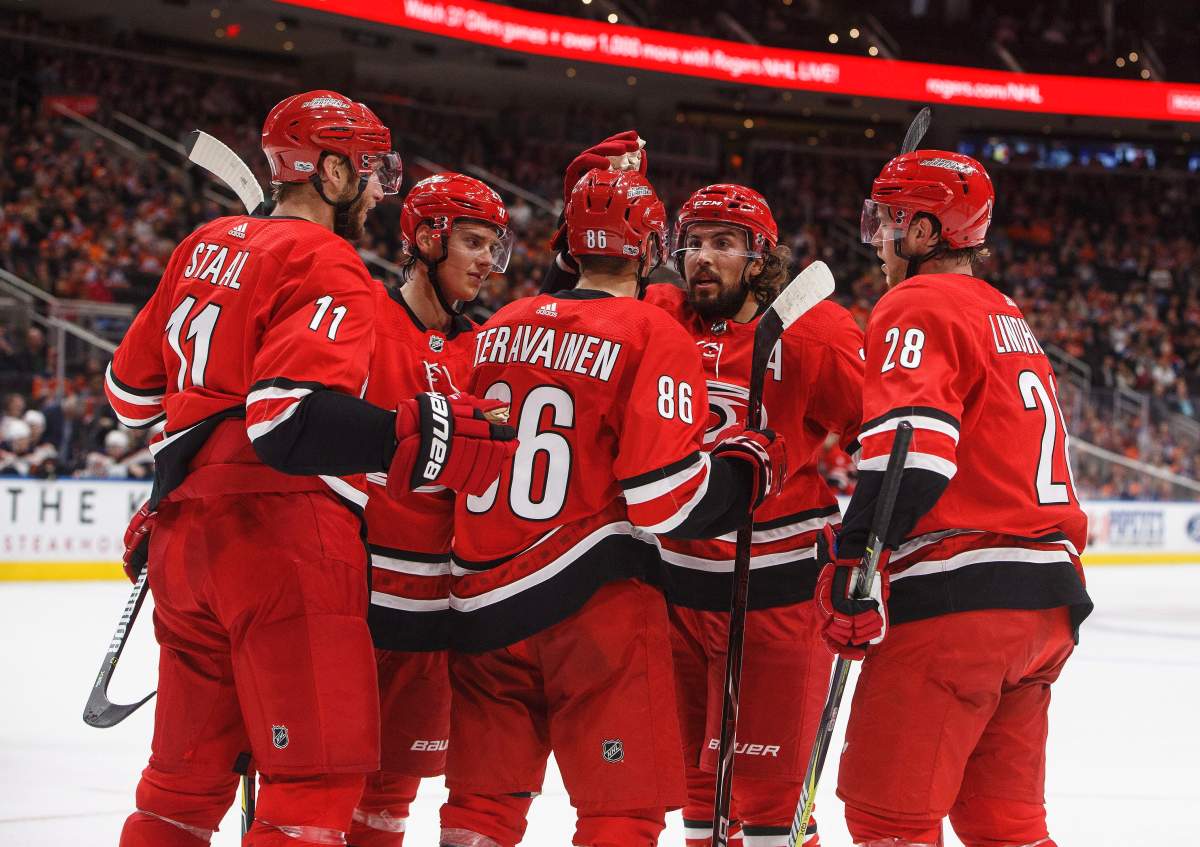 The Carolina Hurricanes celebrate a goal against the Edmonton Oilers during first period preseason NHL action in Edmonton, Alta., on Monday September 25, 2017. THE CANADIAN PRESS/Jason Franson