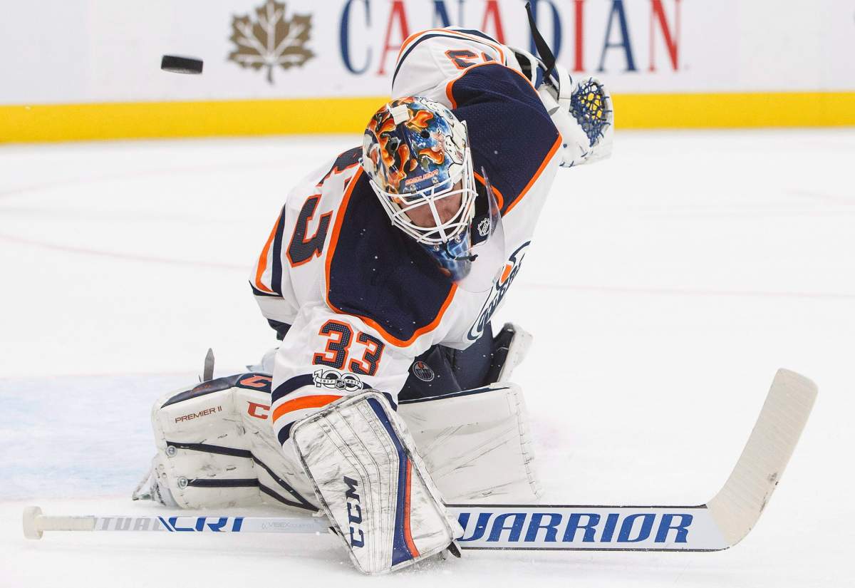 Edmonton Oilers goalie Cam Talbot (33) makes the save against the Carolina Hurricanes during first period preseason NHL action in Edmonton, Alta., on Monday September 25, 2017. THE CANADIAN PRESS/Jason Franson.