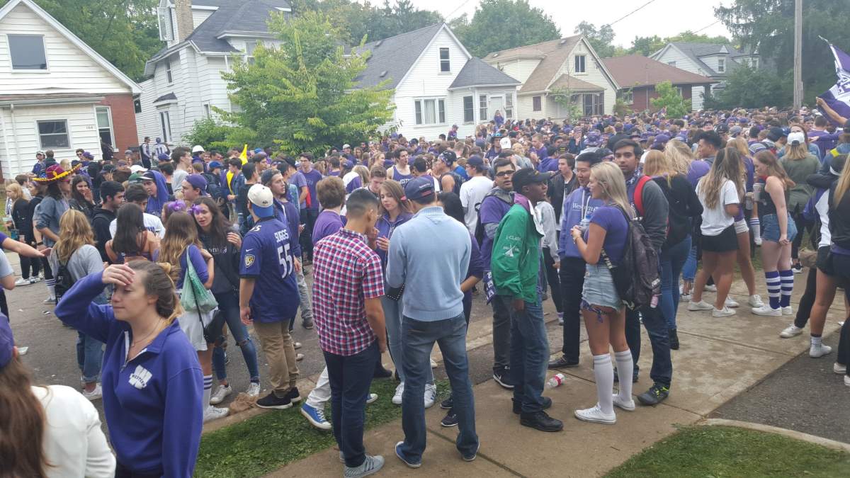 Thousands gather for an unsanctioned Western homecoming street party, Oct. 1, 2016.