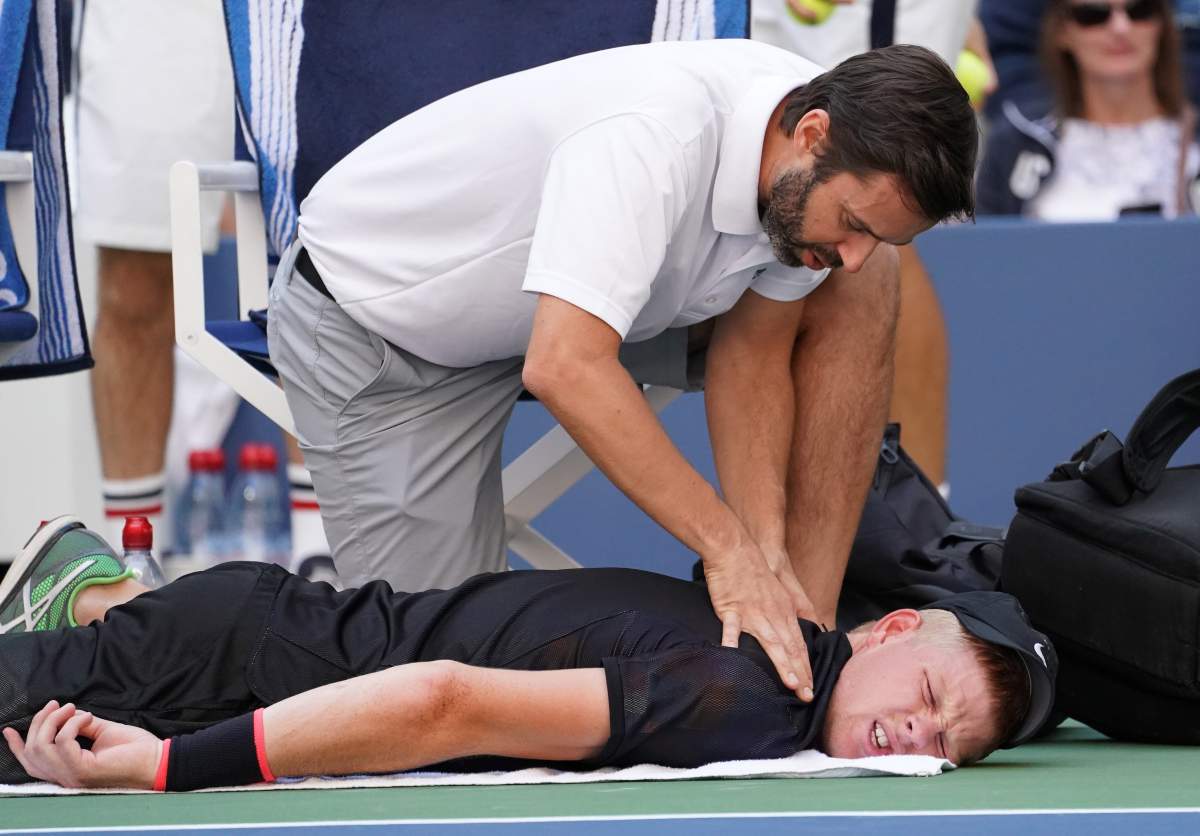 Sept 1, 2017; New York, NY, USA; Kyle Edmund of the United Kingdom gets medical treatment while playing Denis Shapovalov of Canada in Ashe Stadium at the USTA Billie Jean King National Tennis Center.