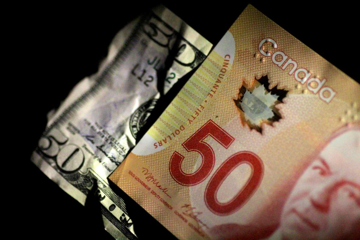 U.S. and Canada Dollar notes are seen in this June 22, 2017 illustration photo. 