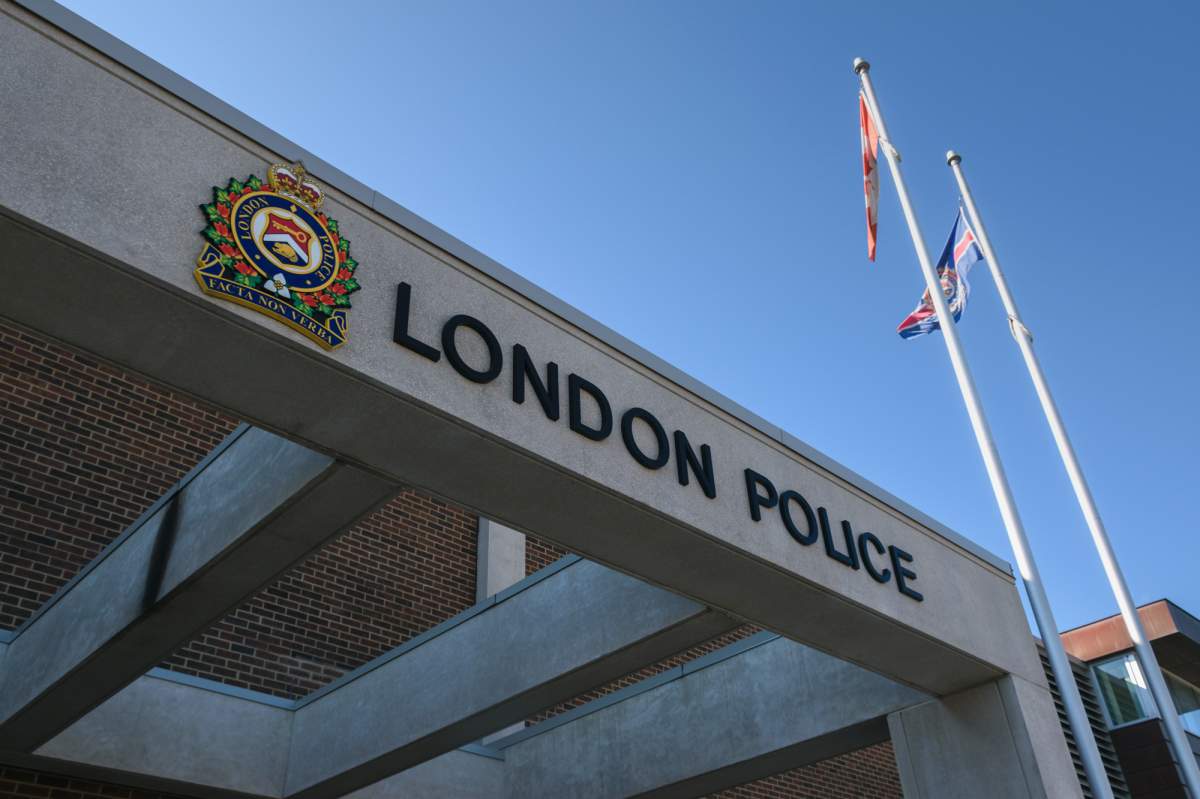 A close-up of the front of London police headquarters on a sunny day.