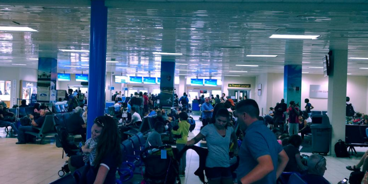 The scene inside the Turks and Caicos Island’s airport as WestJet passengers wait to board a flight Wednesday afternoon.